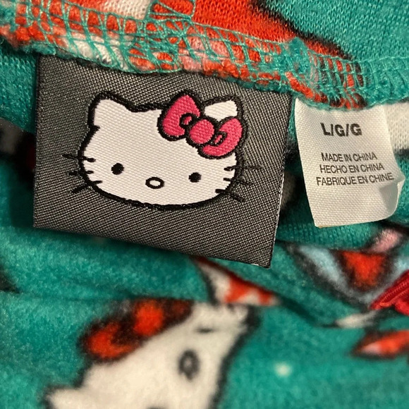Hello Kitty Christmas pajamas onesie in green and red size large
BIN 24​ - Picture 5 of 5